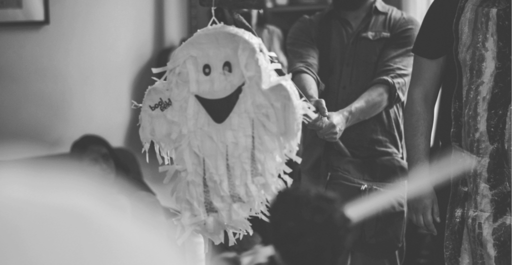This image of a happy ghost piñata illustrates our discussiont topic: Bionic infringers, and keeping brands safe from cyberattacks during spooky season.