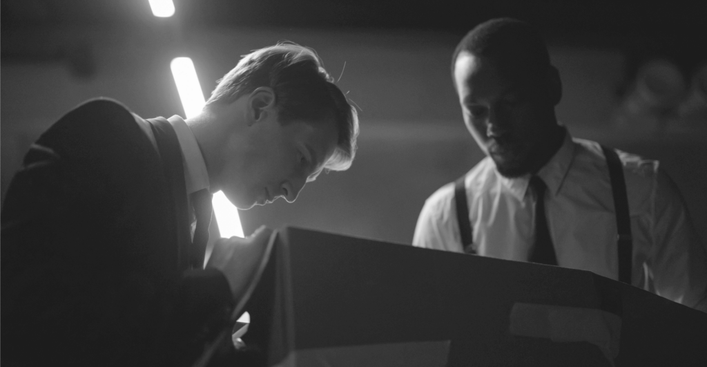 This image of two men looking into a box together illustrates our discussion topic: AI, the practical applications for brand protection, and EBRAND's new DeepVision tools.