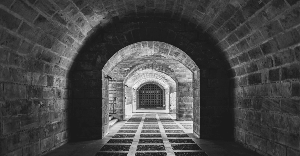 This image of the hallway beneath a castle illustrates our discussion topic: How domain name services help you to defend against cyberattacks.