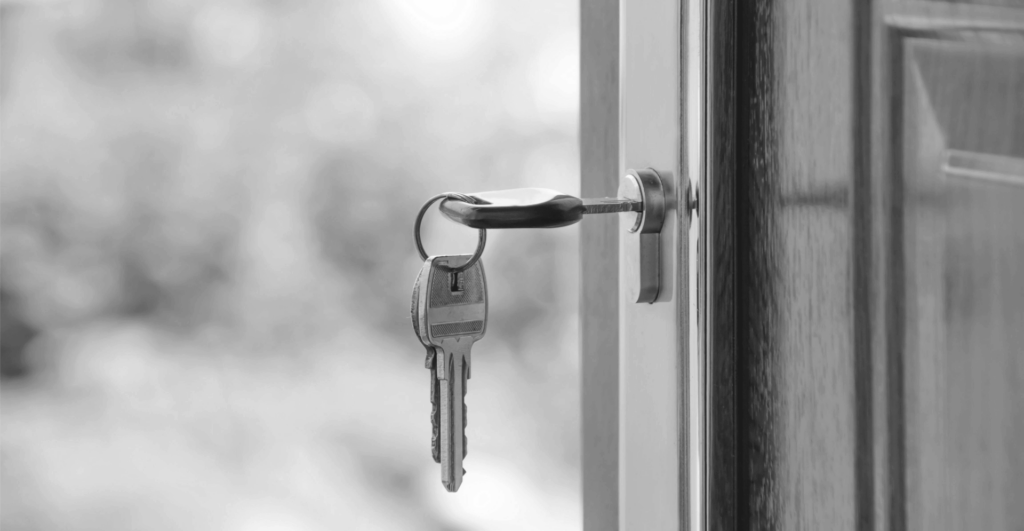This image of a key unlocking a door illustrates our discussion topic: Domain squatting, its impact, and anti-squatting solutions for organizations and individuals.