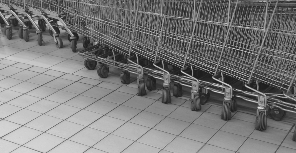 This image of a stack of trolleys / shopping carts illustrates our discussion topic: AI infringements, specifically around ecommerce fraud, and how businesses can fight back with insights from Lisa Deegan on our recent podcast.