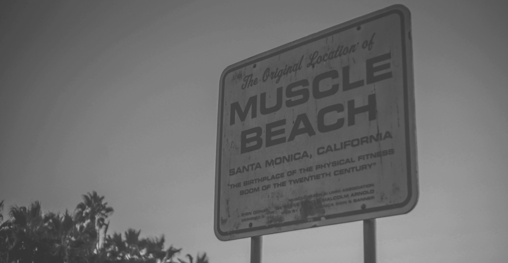 This image of a sign of Muscle Beach in California illustrates our discussion topic: Fitness counterfeits and online scams from jerseys to protein powder, and how brands can fight back/
