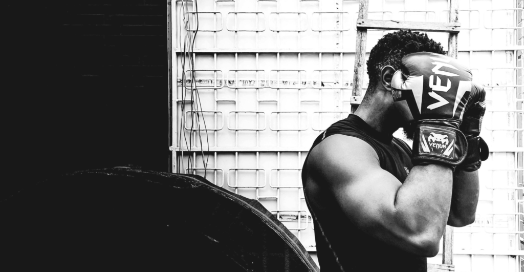 This image of a boxer in the gym illustrates our discussion topic: Fitness counterfeits and online scams from jerseys to protein powder, and how brands can fight back/