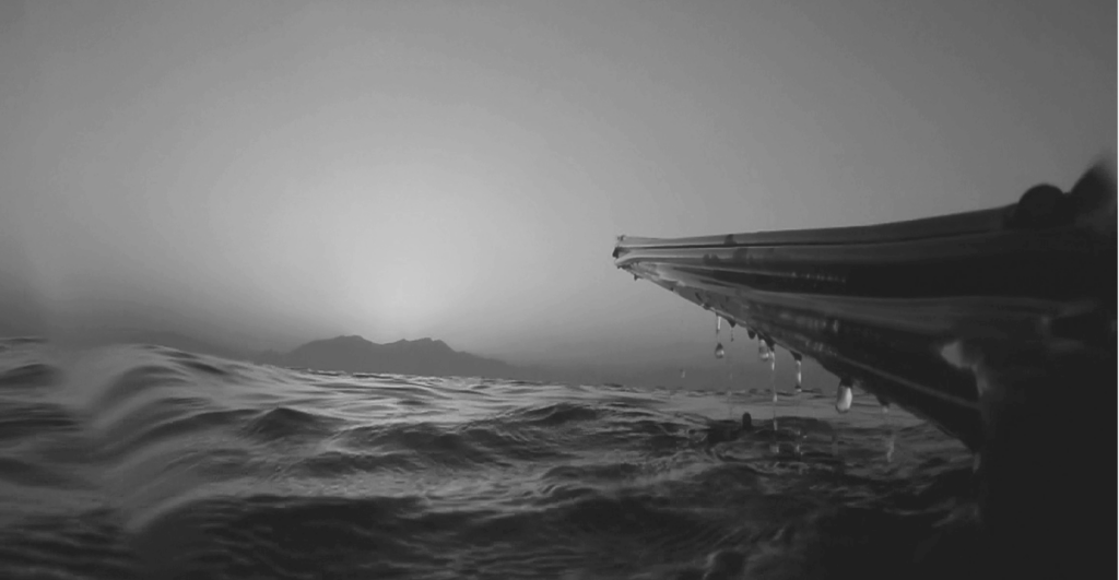 This image of a spear fishing tool above the water at sunset illustrates our discussion topic: The differences between phishing and spear phishing, and how organizations can protect themselves online.