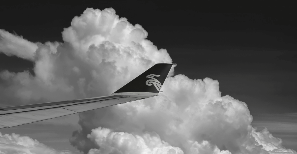 This image of a plane in the sky illustrates our discussion topic: customer service scams in the travel and services industries.