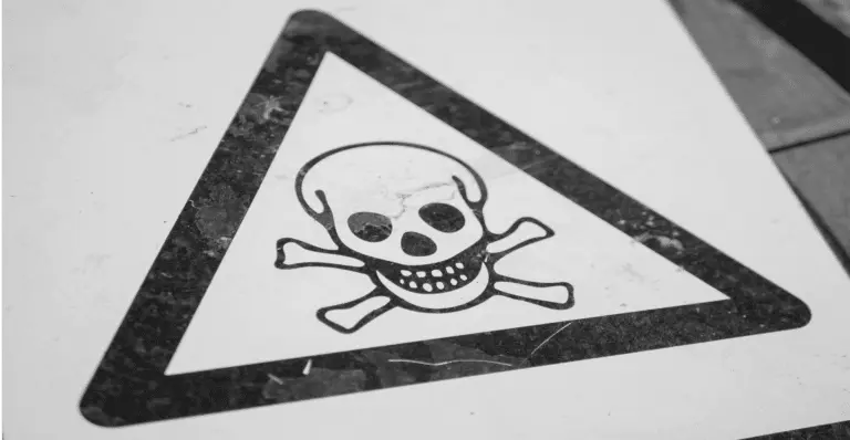 Warning sign with skull and crossbones symbolizing the danger of counterfeit products